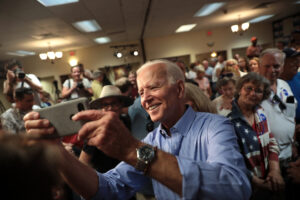 Former Vice President of the United States Joe Biden speaking with supporters at a community event at the Best Western Regency Inn in Marshalltown, Iowa./Courtesy • Gage Skidmore via Flickr