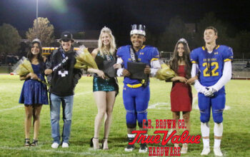 Homecoming court poses for a picture after Hannah Whitted and Boni Jacinto are crowned King and Queen. /Nadia Novi • The Brand