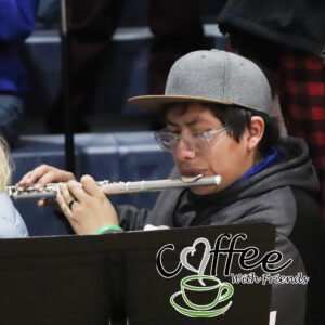 Yovany Balderas playing the flute at a home basketball game./ Alexis Galarza • The Brand