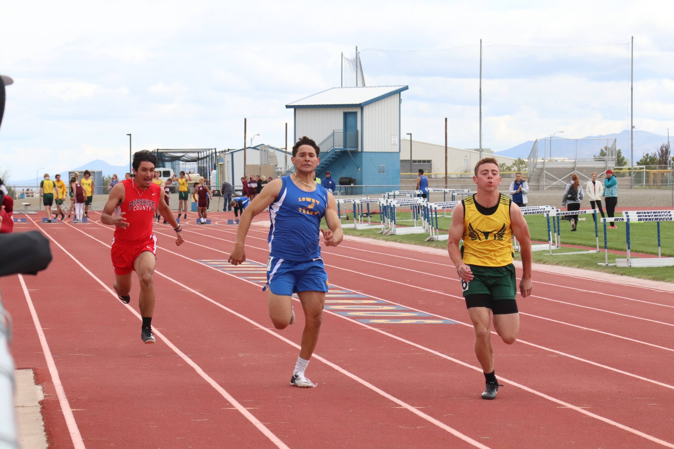 Roberto Lopez runs in the home track meet./Staff • The Brand