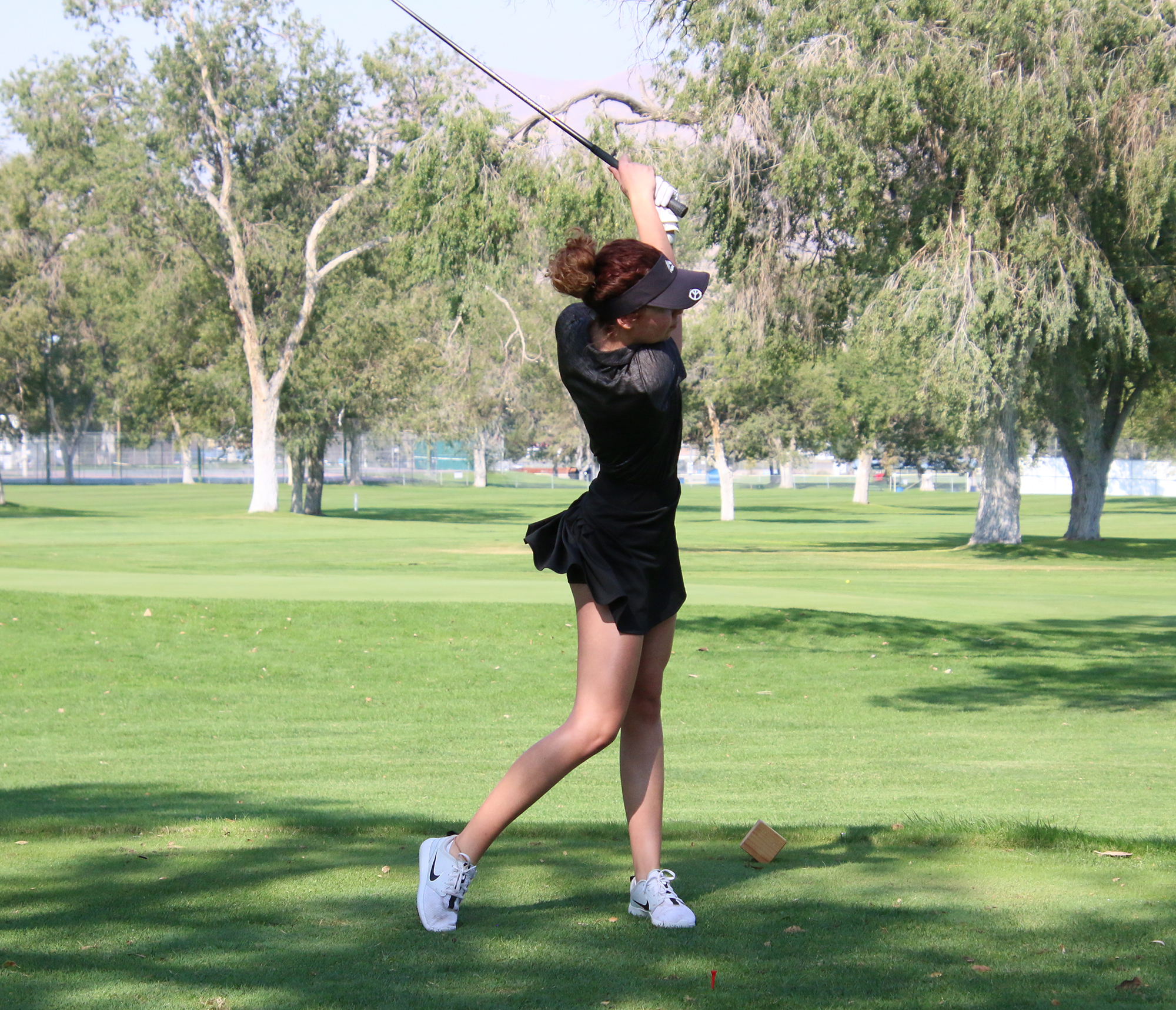 Bailey Hayes tees off. /Maddi McClure • The Brand
