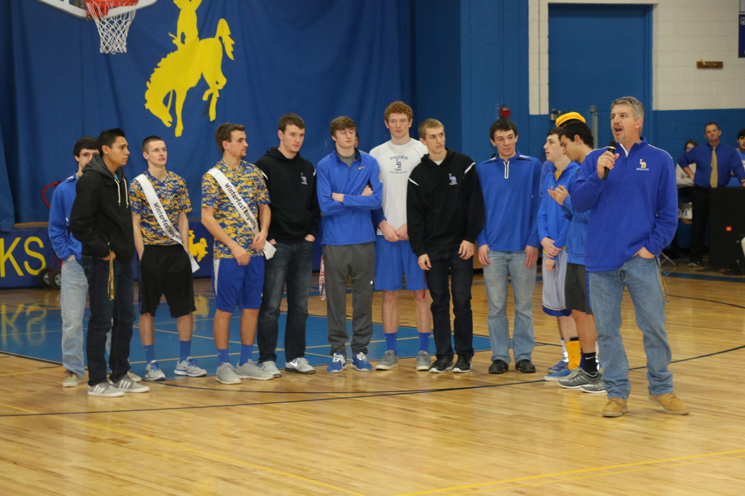 Chad Peters and the 2015 basketball team at a pep assembly. /Ron Espinola • The Brand