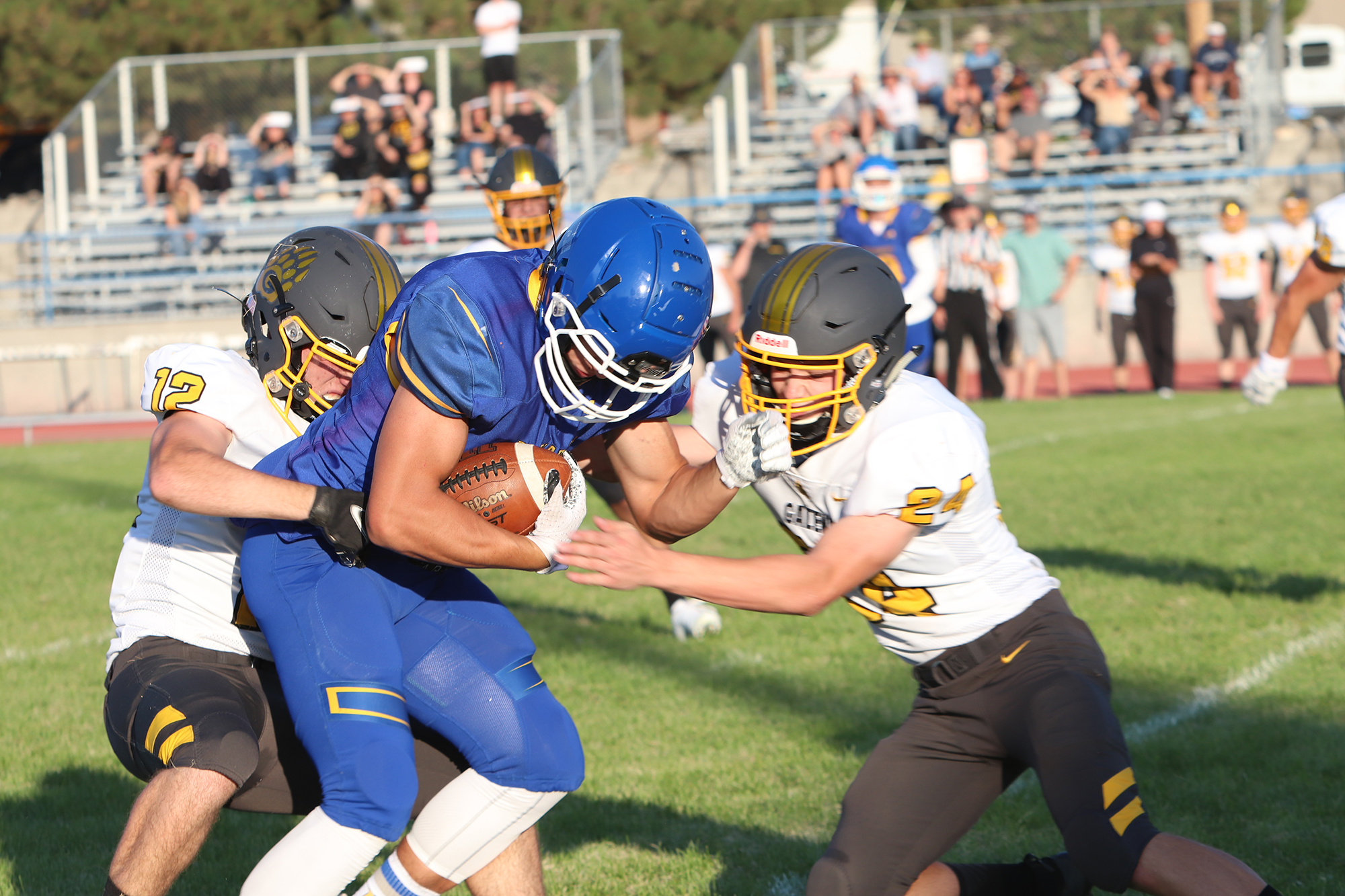 Giovani Sapien is tackled by Galena defenders. /Jaycee Harber The Brand