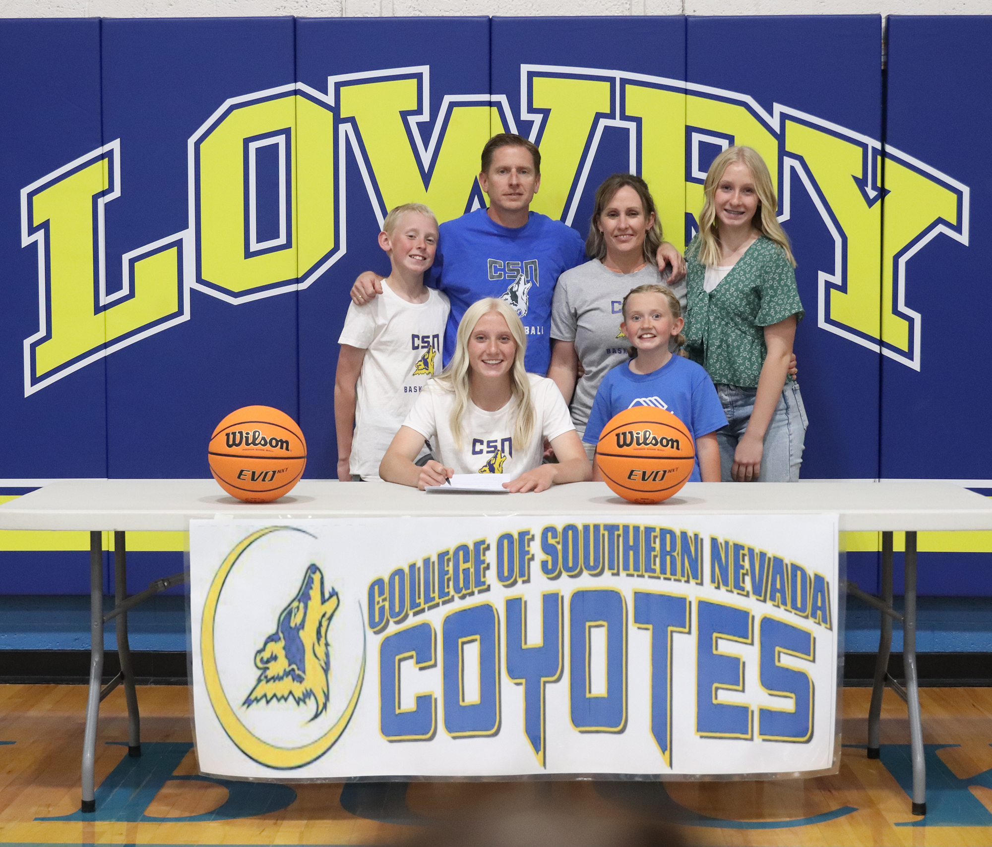 Emily Backus signs to play basketball for CSN  with her family by her side. /Ron Espinola • The Brand