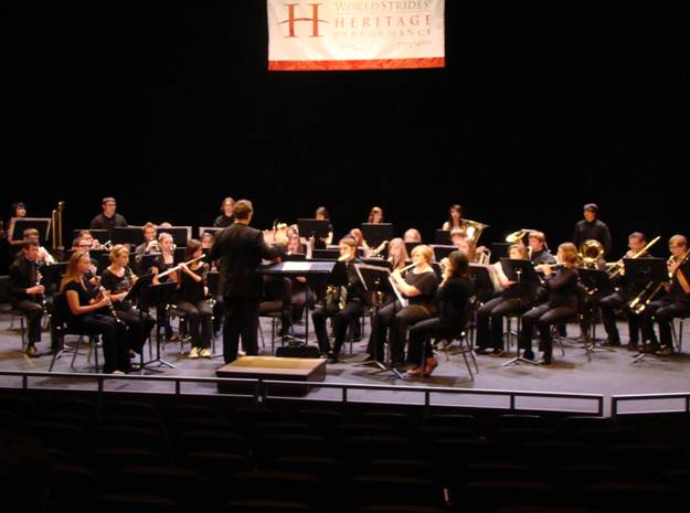 Lowry High School's concert band competing at the Heritage Music Festival, with their director Mr. Paul Criddle, pictured in the center./ The Brand • Jolyn Garcia