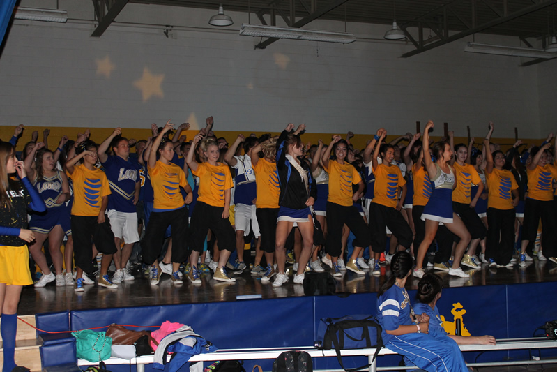 The Dance team and cheerleaders dance at Friday’s assembly./Justin Albright • The Brand