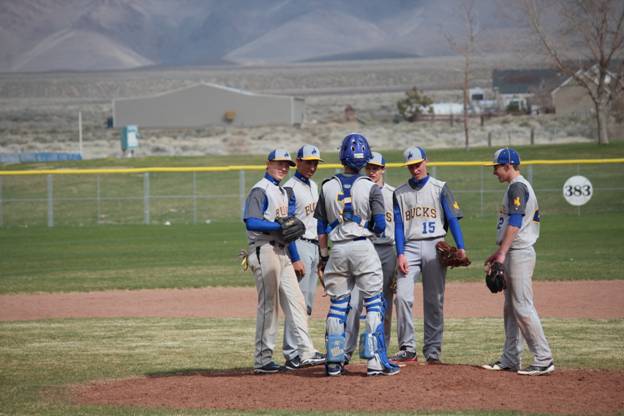 The team holds a mound conference. /Courtesy Katie Donovan