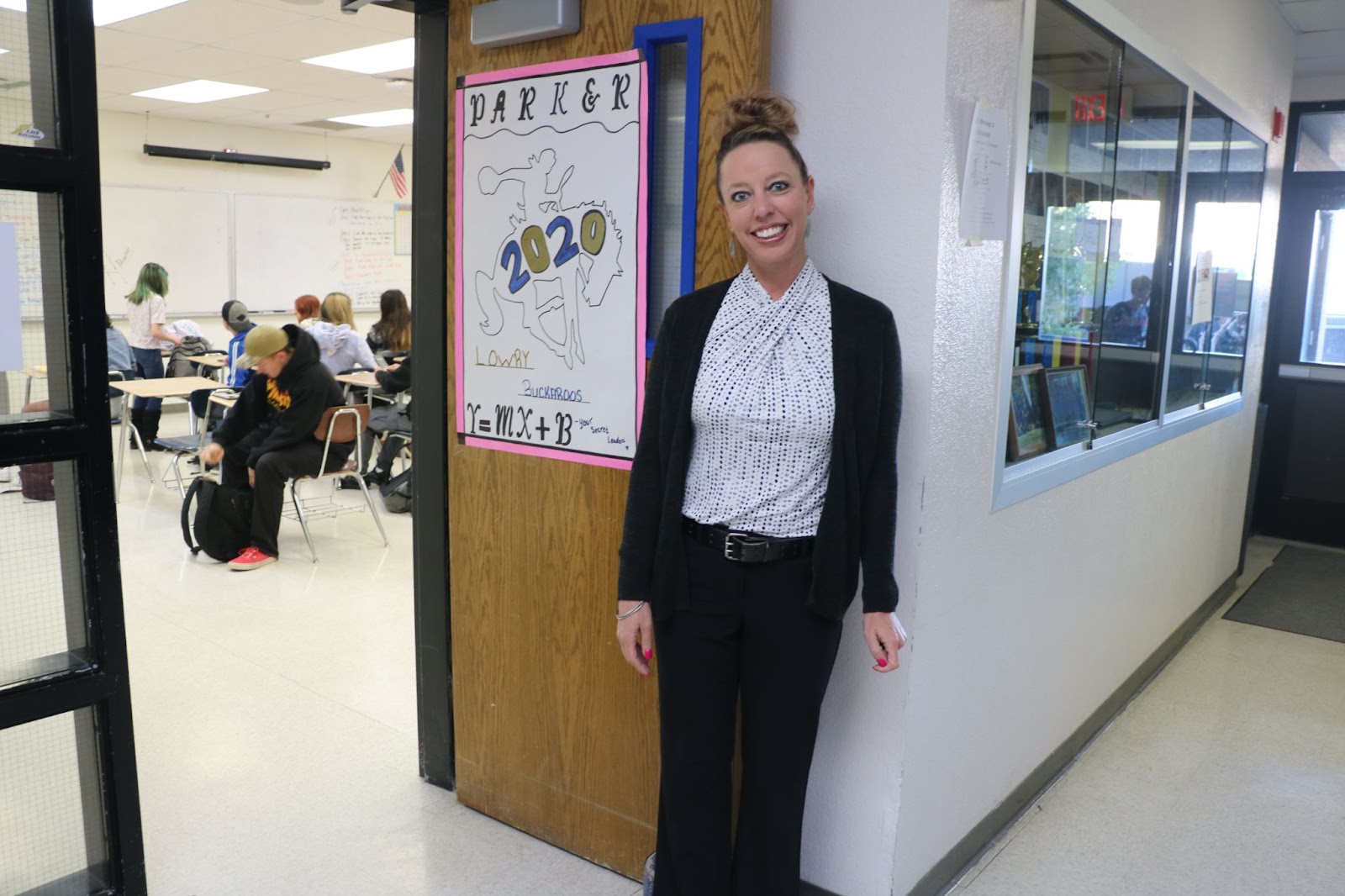 Ms. Parker stands outside her classroom to show off her “Dress for Success” outfit. /Cylie Spriet • The Brand
