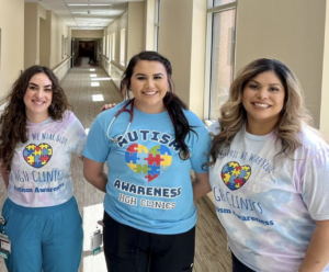 Lizbeth Diaz poses with coworkers to show off their Autism Awareness shirts. / Courtesy • Lizbeth Diaz
