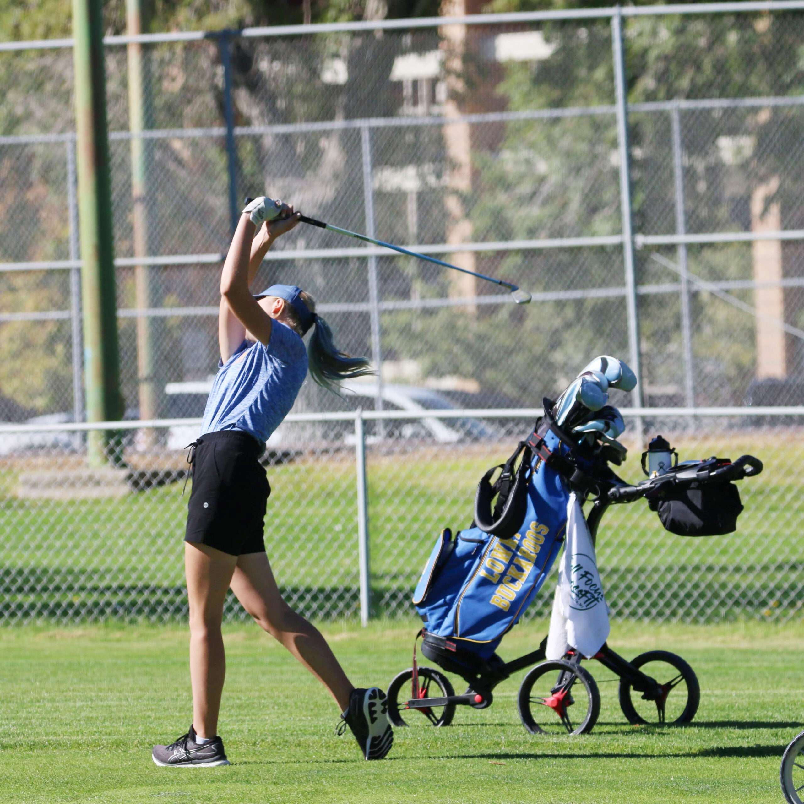  Lainey Novacek tees off at hole nine. /Alexis Galarza • The Brand