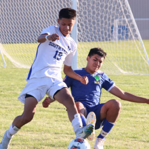 Gabriel Mendoza slide tackles his opponent from South Tahoe. /Ron Espinola • The Brand