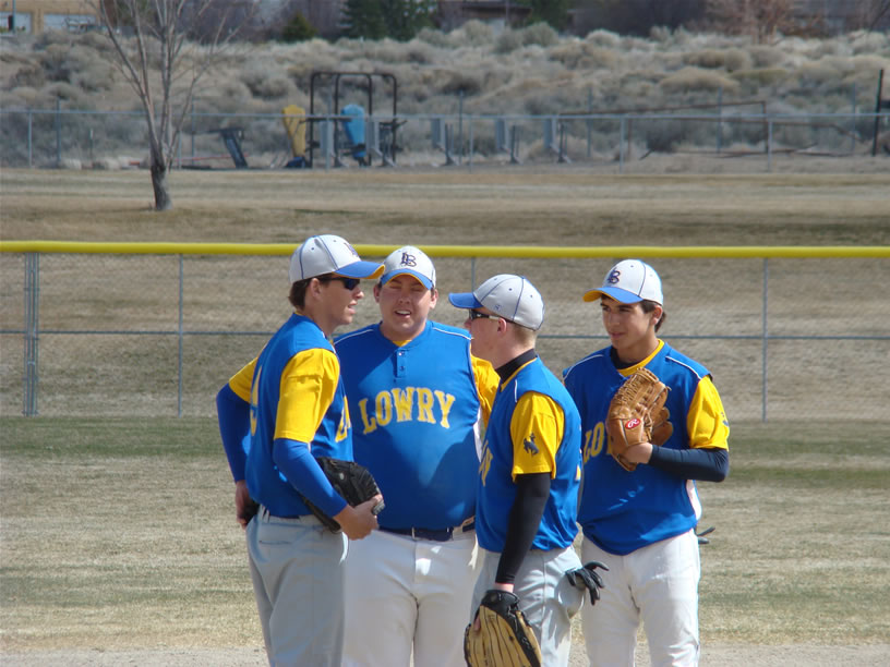 Zack Pruett and teammates meet on the mound between innings in 2008. /Staff • The Brand