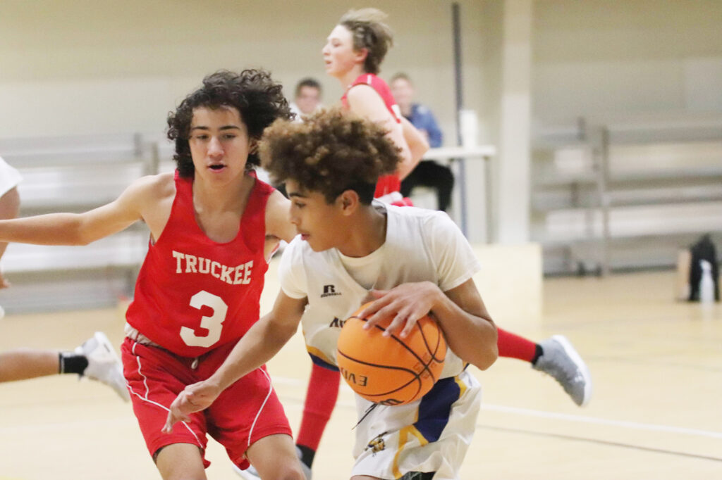 Nigel Green dribbles by a defender during the Truckee game. /Juliana Blatzheim • The Brand
