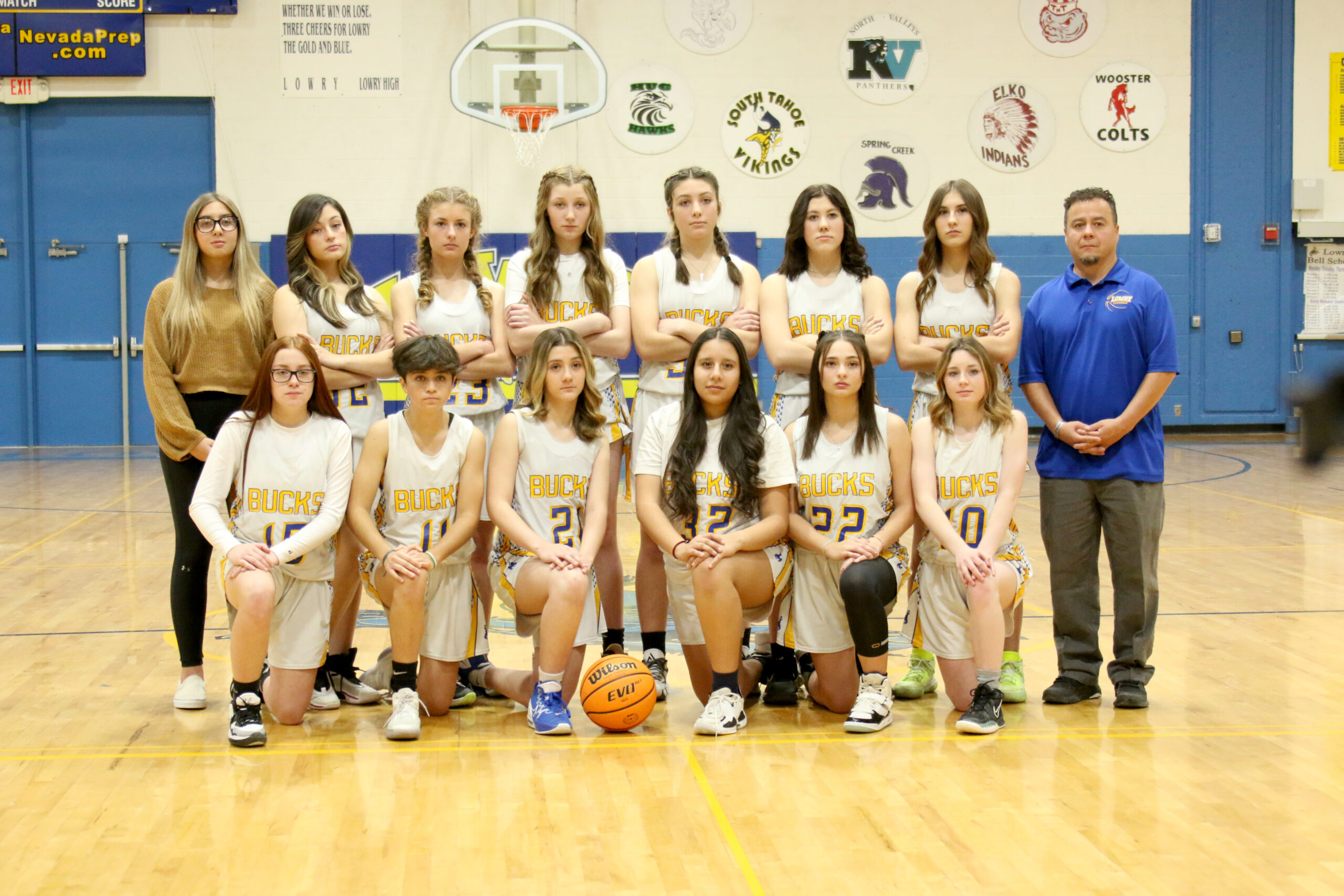 The new 2022 freshman girl’s basketball team poses for a team picture. /Olivia Espinola • The Brand