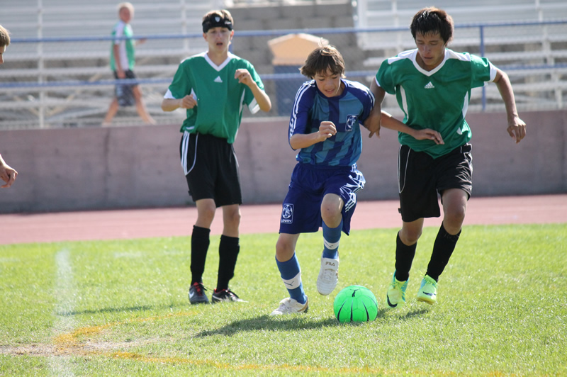 Andre Avalos fights a Fallon player for possession of the ball./Jolyn Garcia • The Brand