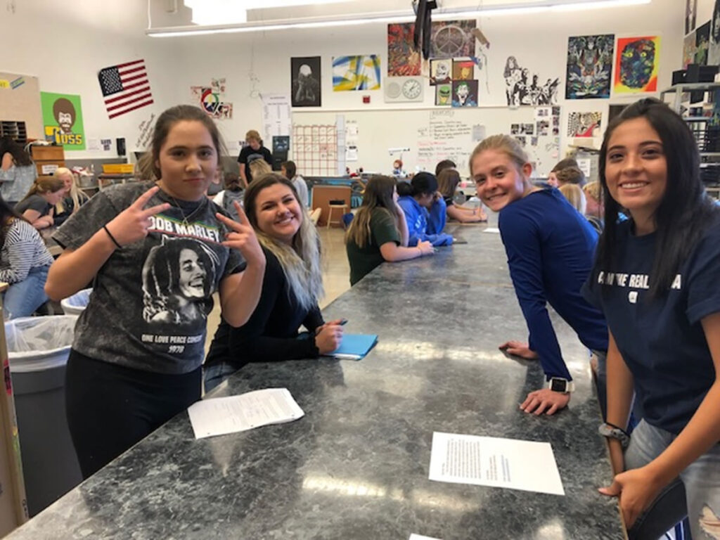 Erin Acosta, Mady Lujan, Makayla Leveille, and Celest Castellanos planning assembly games./Mackie Grady • The Brand