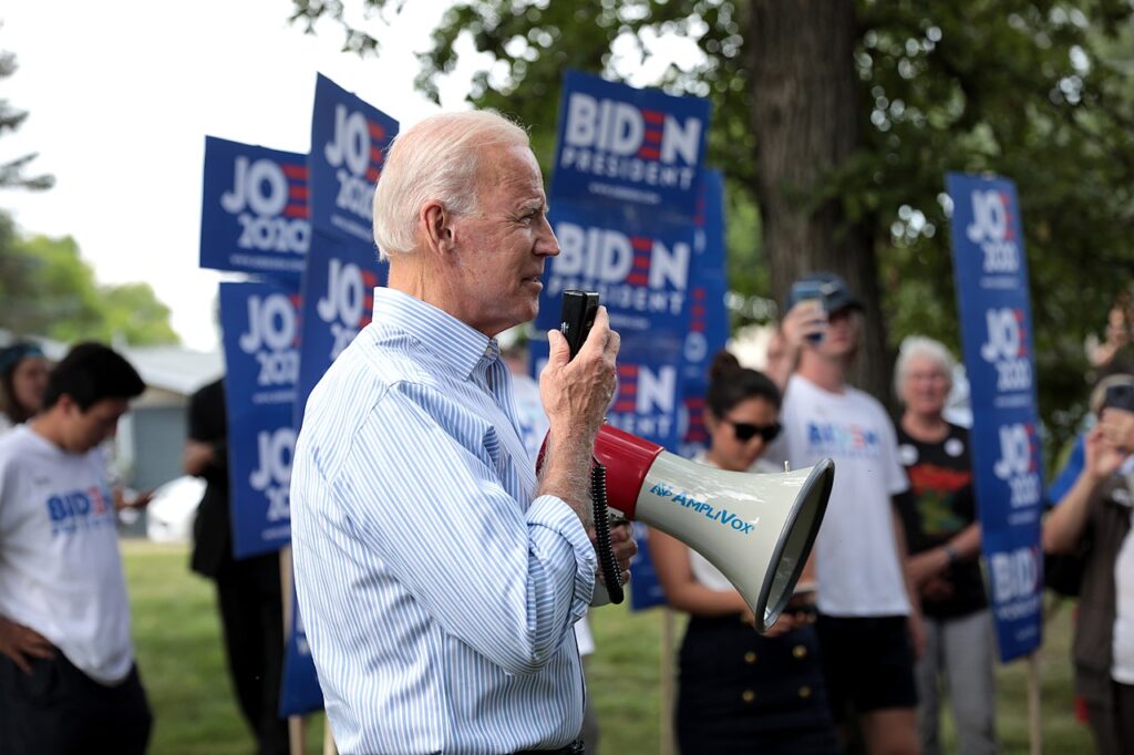 Former Vice President Joe Biden speaking with supporters at a pre-Wing Ding rally at Molly McGowan Park in Clear Lake, Iowa./ Courtesy • Gage Skidmore via Flickr