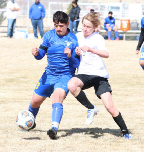 Omar Castaneda fights for control over the ball. /Ron Espinola • The Brand