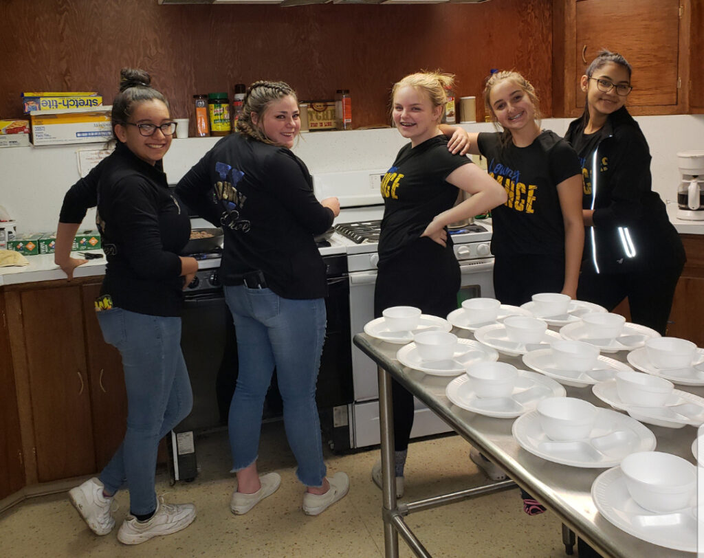 Lowry dance team members working at the Winnemucca Soup Kitchen/Courtesy • Lowry Dance