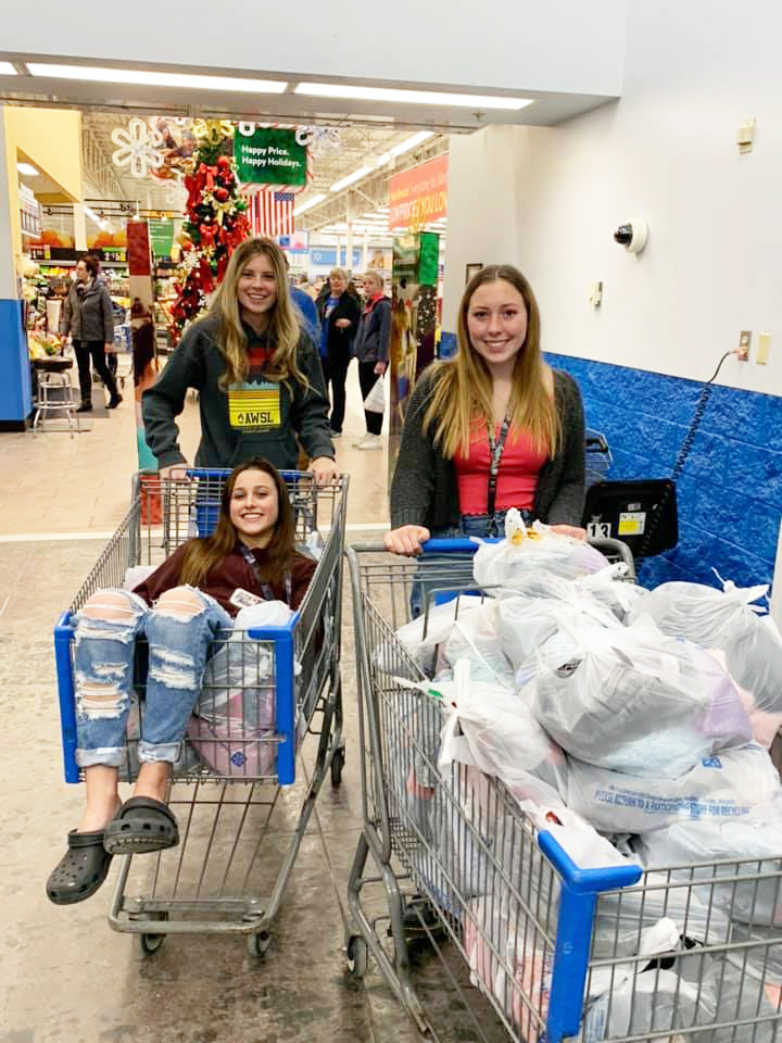 Students with gifts for donations during the holidays./Courtesy