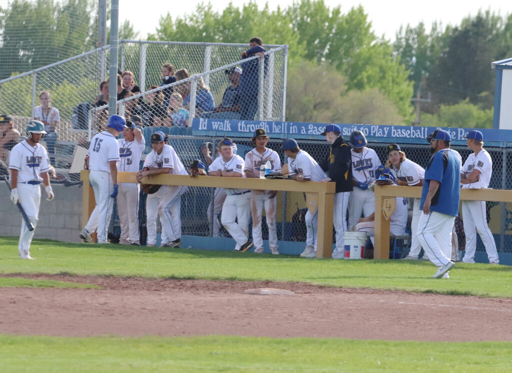 Varsity baseball in the dugout. /Ron Espinola • The Brand
