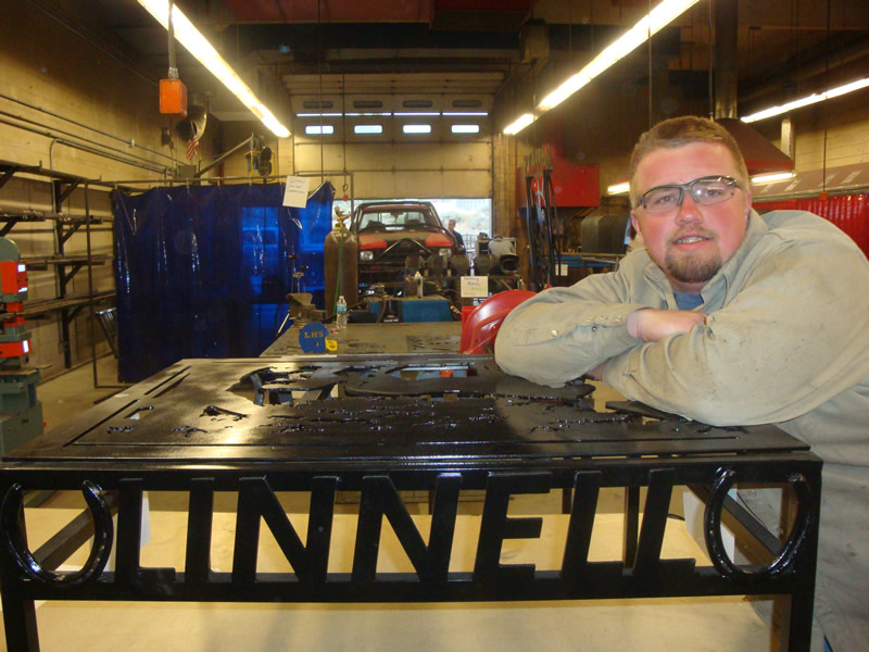 Mark Linnell shows off his welding project. /Harley Long • The Brand