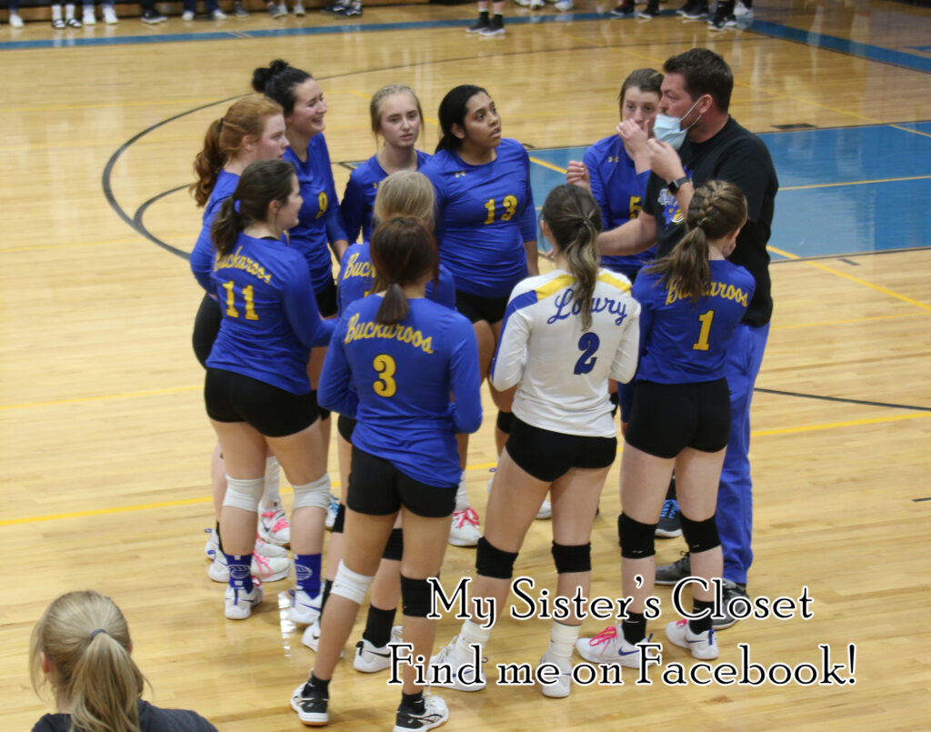 JV volleyball in a team huddle at their game against Spring Creek at home./Ron Espinola • The Brand