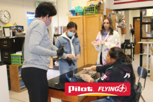 Mrs. Mattson shows Otila Castaneda and other students rat organs during a dissection./ Ron Espinola • The Brand