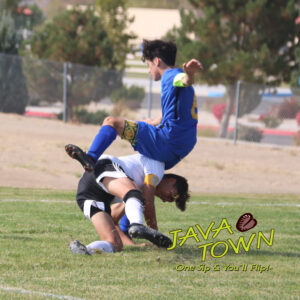 Diego Contreras jumps over another player to get the ball. /Alora McClure • The Brand