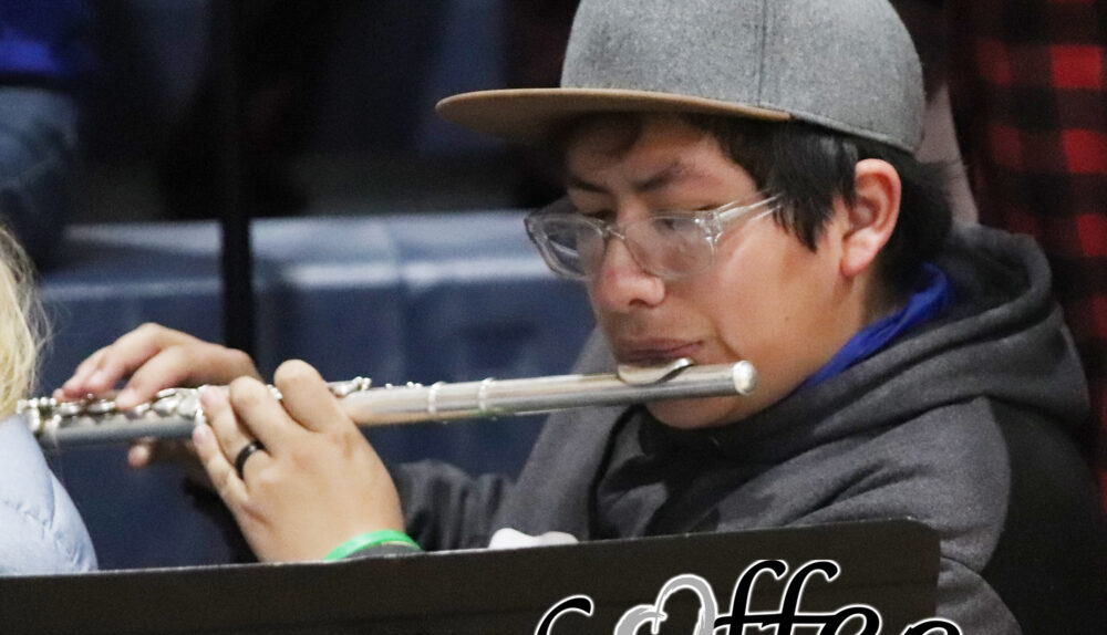 Yovany Balderas playing the flute at a home basketball game./ Alexis Galarza • The Brand