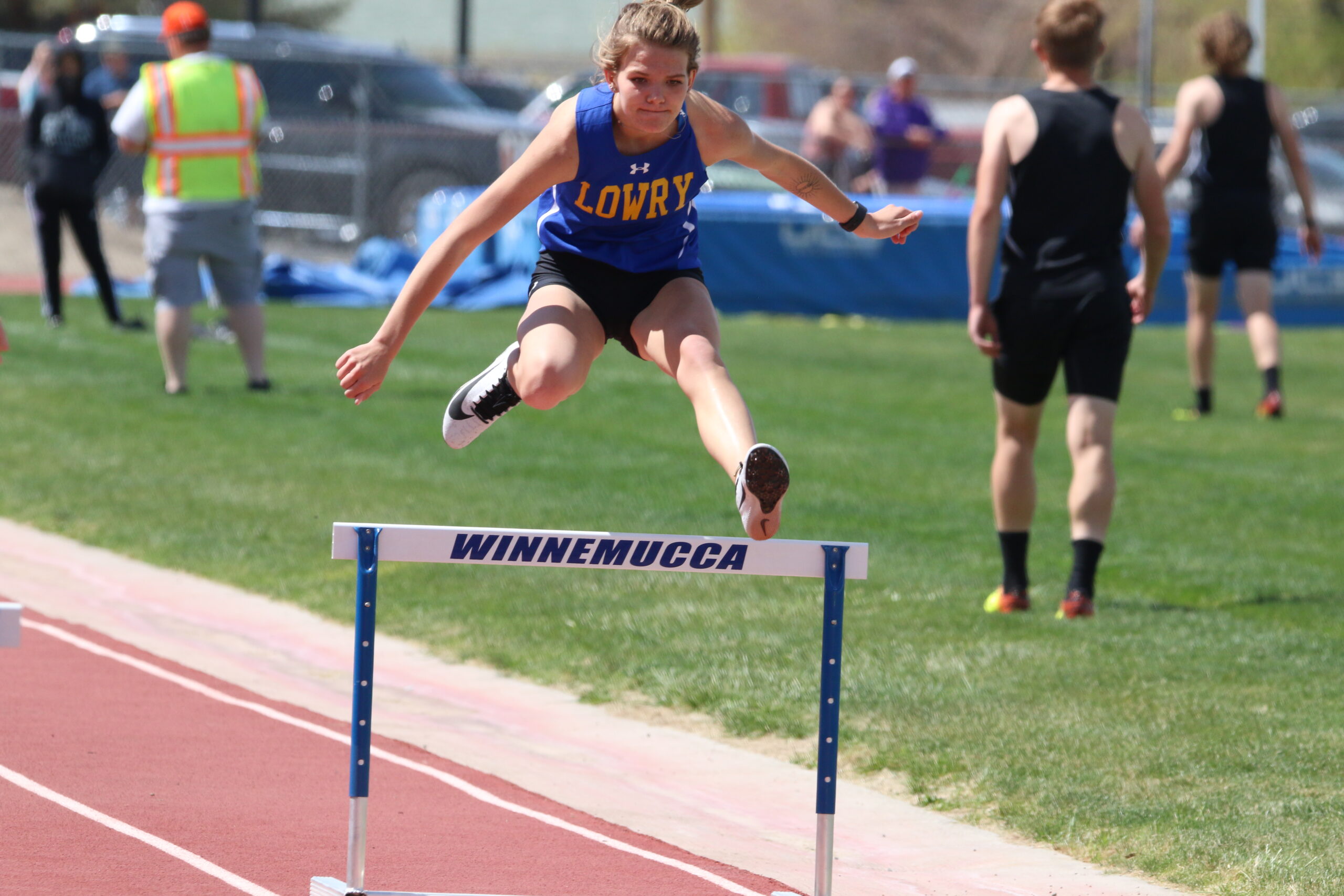 Jovi Kuskie jumps over a hurdle in last years track meet./Ron Espinola • The Brand