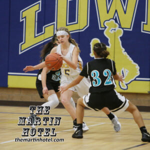 Natalee Formby dribbles the ball away. /Ron Espinola • The Brand