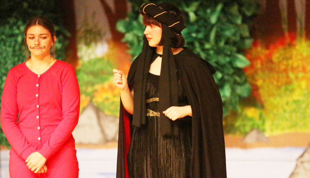 Sims (right) performing in “Robin Hood” as Lady Merle. /Danielle Scott • The Brand