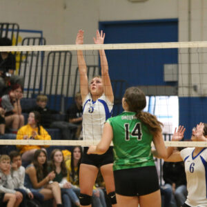 Audry Mason blocks the middle of the net against Churchill County Greenwave. /Ron Espinola • The Brand