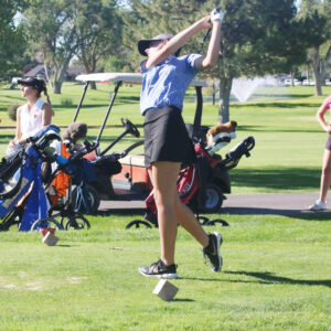 Katlyn Cassaneli tees off at the home tournament leading her to qualify for state. /Alexis Galarza • The Brand