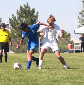 Luis Mendoza fights for the ball against South Tahoe. /Chloe Bice • The Brand