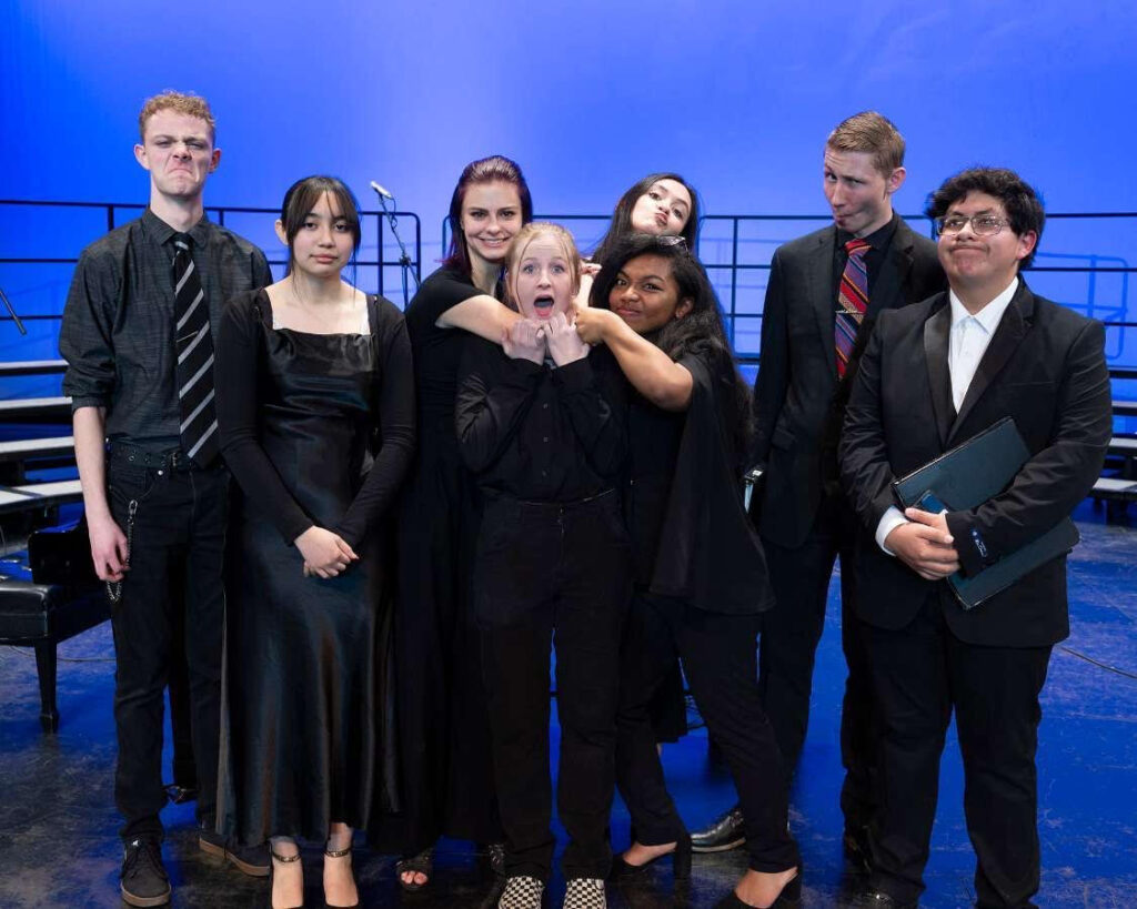 The choir poses for a funny picture before their show./ Courtesy • David Munk