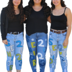 Belen, Leticia, and Alex pose together wearing matching jeans. /Kailey Franklin • The Brand