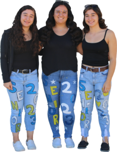 Belen, Leticia, and Alex pose together wearing matching jeans. /Kailey Franklin • The Brand