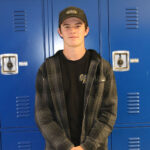 Randy Patterson poses for the camera after being chosen as Student of the Week. /Alexa Toscano • The Brand