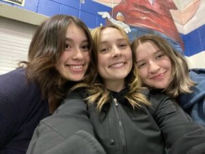 Natalie Pacheco, Myla Jones, and Angeleena Burke smile for a selfie at their work at the Boys and Girls Club./ Courtesy • Angeleena Burke