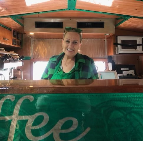 Jill Stepper smiles for the camera while working on her coffee bus./Destiny Medicine Cloud • The Brand