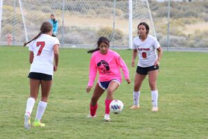 Yareli Avila Garcia takes control of the ball from the opposing Pershing County./ Ron Espinola • The Brand