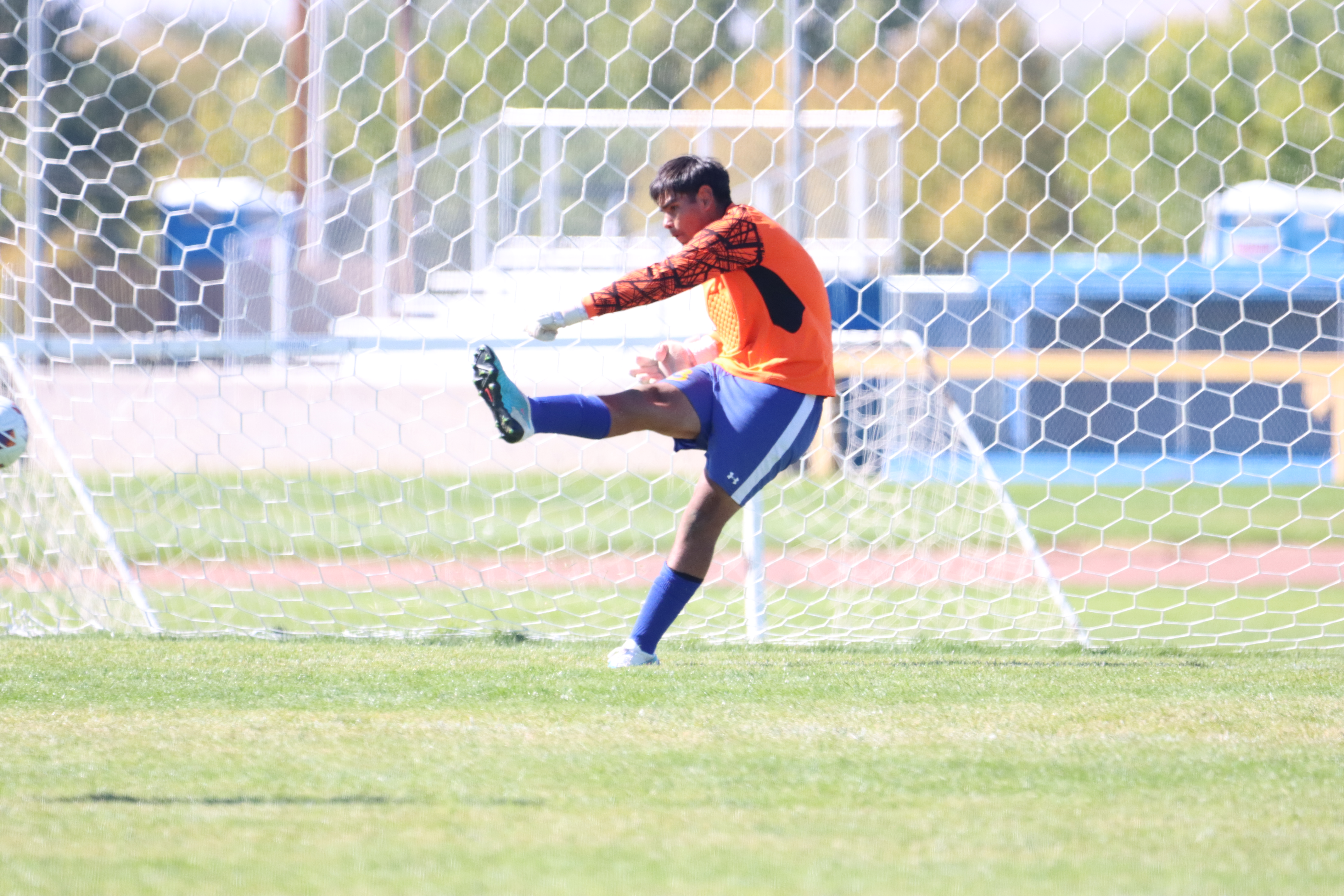 Goalie, Izayus Barajas makes a kick toward their goal./Ron Espinola • The Brand