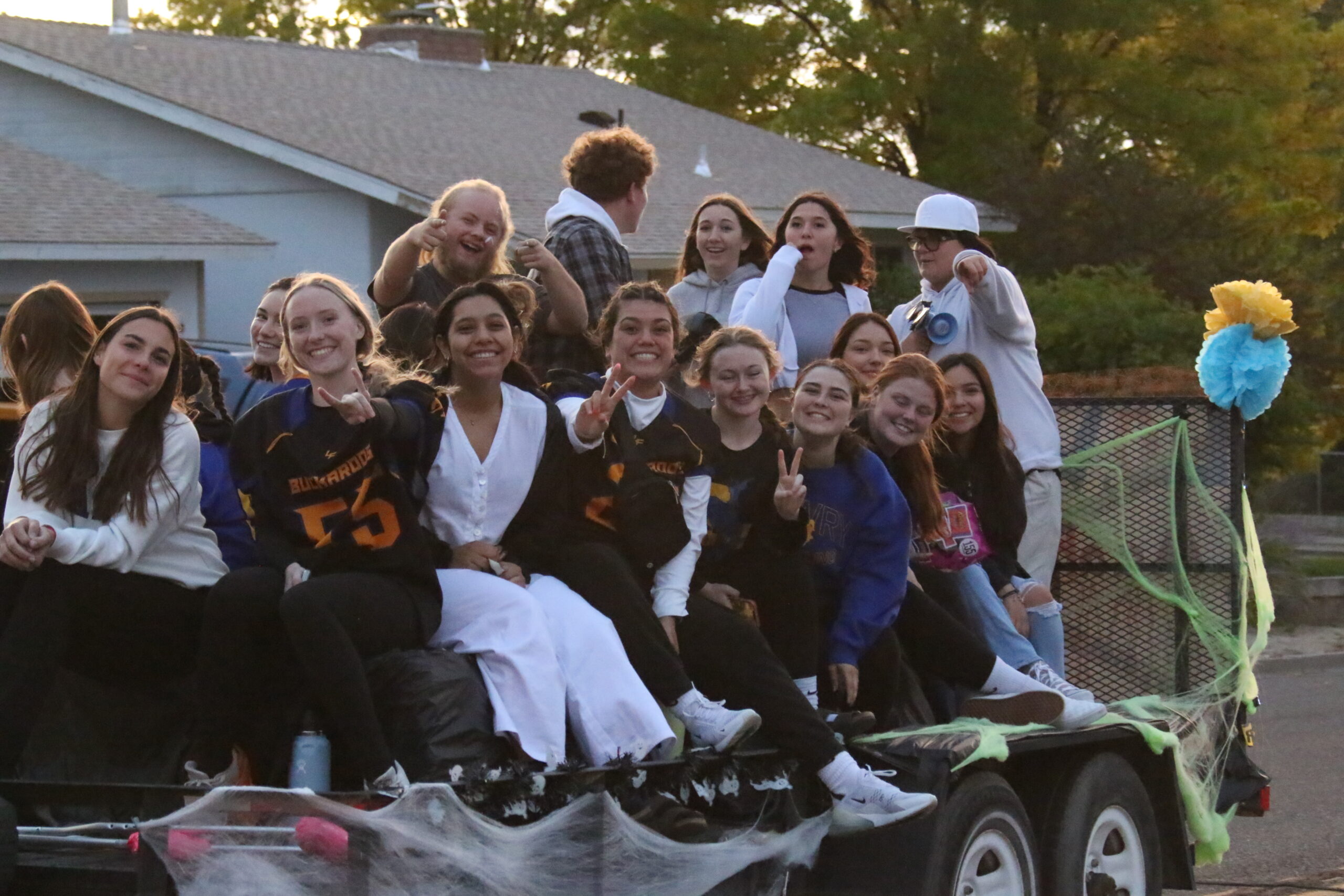 Senior class rides the homecoming parade float together on their way to the Powderpuff game./ Ron Espinola • The Brand