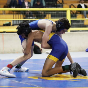 Kruz Gomez fights to get back on top during the South Tahoe duals at the Winnemucca Event Center./ Olivia Espinola • The Brand