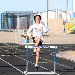 Ryder Huitt jumps over a hurdle during practice./Ron Espinola • The Brand