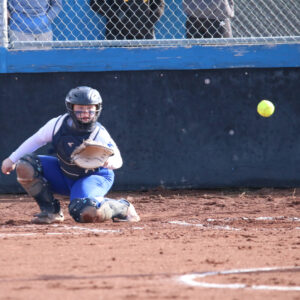 Maddison McClure catches for Savannah Stoker during a game against Wooster./Ron Espinola • The Brand