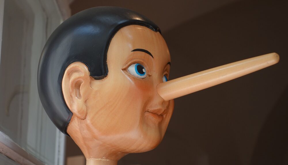 Wooden sculpture of Pinocchio lying. /Courtesy • Roland Schwerdhöfer via Pixabay