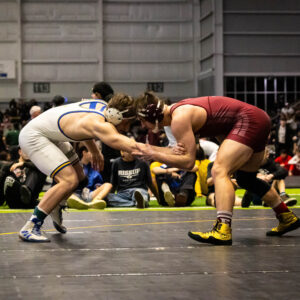 Luke Fentress prepares to take down his opponent during State. /Courtesy • Cripps Photography